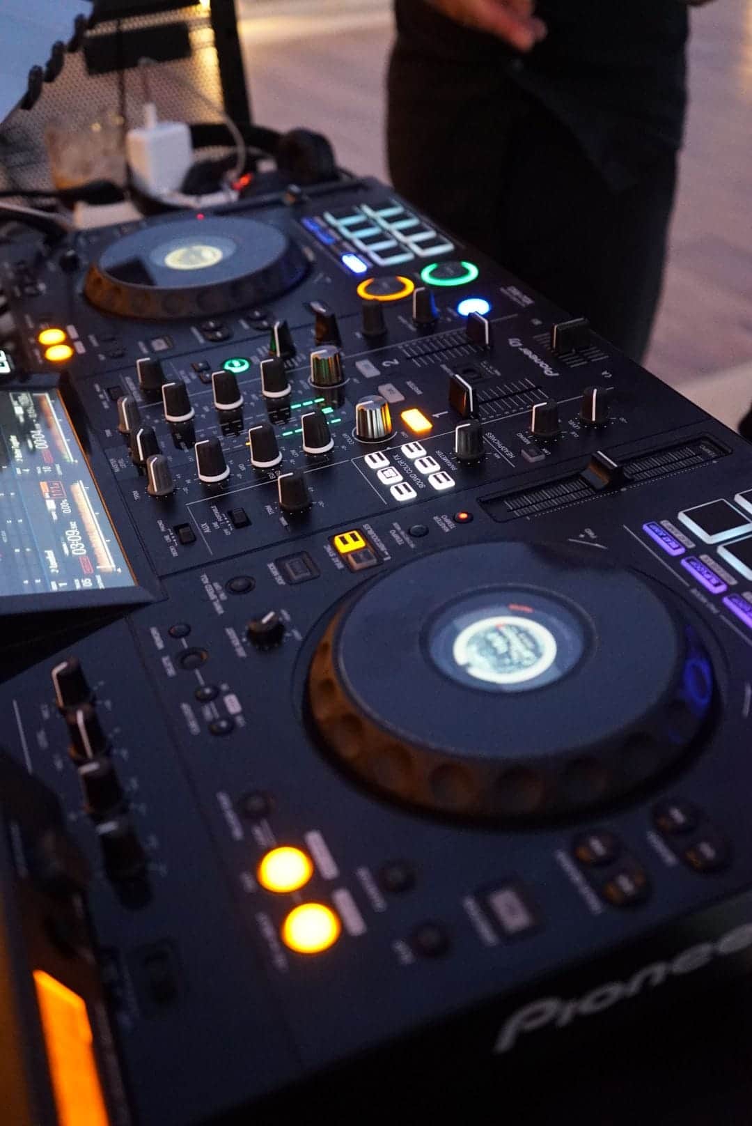 Close-up of a Pioneer DJ controller during an evening event